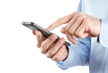 Close up of man using smart phone isolated on white background