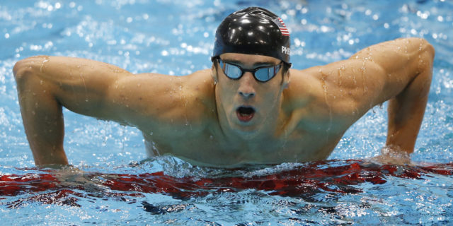 United States' Michael Phelps gets out of the water after swimming butterfly in the men's 4 X 100-meter medley relay at the Aquatics Centre in the Olympic Park during the 2012 Summer Olympics, London, Saturday, Aug. 4, 2012. (AP Photo/Jae C. Hong)