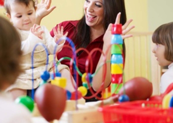 female toddler and 2-3 years girl playing in kindergarten. Horizontal shape