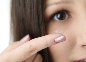 beautiful human eye and contact lens on white background