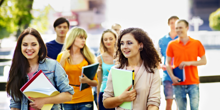 group student with notebook outdoor