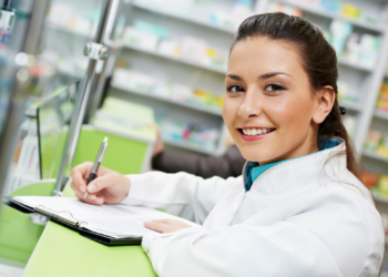 Pharmacy chemist woman in drugstore