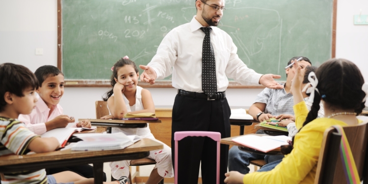 teacher with children in classroom boys and girls in school