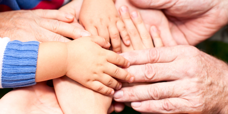 family holding hands together closeup