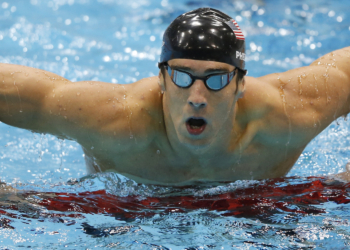 United States' Michael Phelps gets out of the water after swimming butterfly in the men's 4 X 100-meter medley relay at the Aquatics Centre in the Olympic Park during the 2012 Summer Olympics, London, Saturday, Aug. 4, 2012.  (AP Photo/Jae C. Hong)