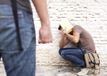 Teenager student with fear at his school (selective focus)