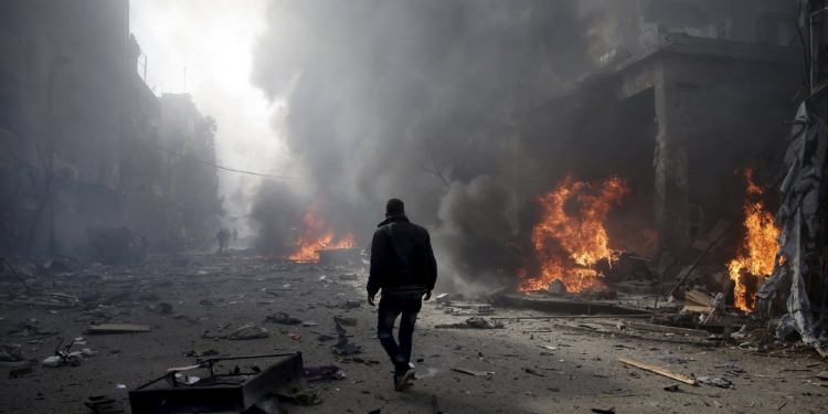 a man inspects a site hit by what activists said were airstrikes by forces loyal to syrias president bashar al assad in the douma neighborhood of damascus syria