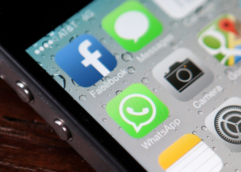 SAN FRANCISCO, CA - FEBRUARY 19:  The Facebook and WhatsApp app icons are displayed on an iPhone on February 19, 2014 in San Francisco City. Facebook Inc. announced that it will purchase smartphone-messaging app company WhatsApp Inc. for $19 billion in cash and stock.  (Photo illustration by Justin Sullivan/Getty Images)