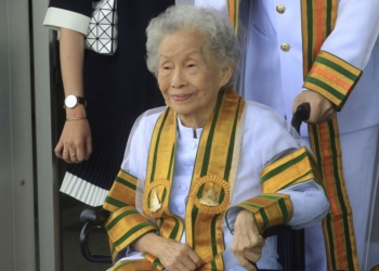 In this Wednesday, Aug. 9, 2017,
Kimlun Jinakul 91 year-old sits on cart graduate from Sukhothai Thammathirat Open University before receiving her bachelor’s degree from Thailand's King Maha Vajiralongkorn Bodindradebayavarangkun. (AP Photo/Str)**Thailand Out**