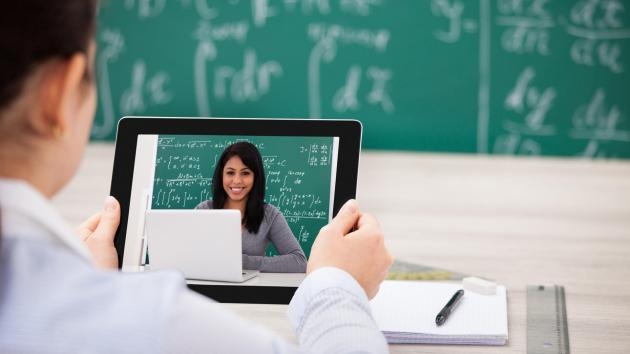 woman having videochat with digital tablet