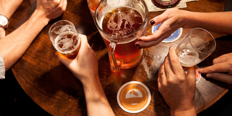 people drinking beer shot from overhead