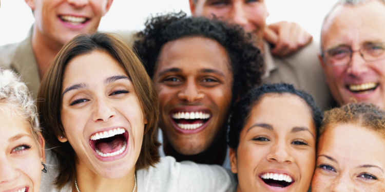 closeup portrait of a group of business people laughing