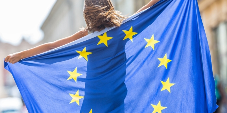 eu flag cute happy girl with the flag of the european union young teenage girl waving with the european union flag in the city