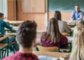 rear view of high school students attending a class