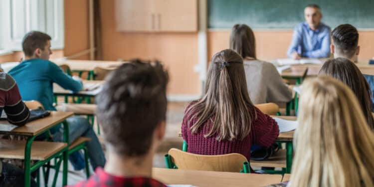 rear view of high school students attending a class