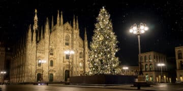 milan italy in winter christmas tree in front of milan cathedral duomo square in december night view starry sky