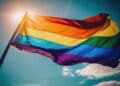 lgbt pride flag and blue sky background