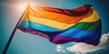 lgbt pride flag and blue sky background