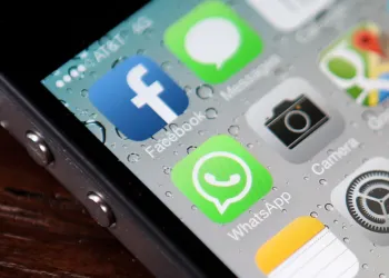 SAN FRANCISCO, CA - FEBRUARY 19: The Facebook and WhatsApp app icons are displayed on an iPhone on February 19, 2014 in San Francisco City. Facebook Inc. announced that it will purchase smartphone-messaging app company WhatsApp Inc. for $19 billion in cash and stock. (Photo illustration by Justin Sullivan/Getty Images)